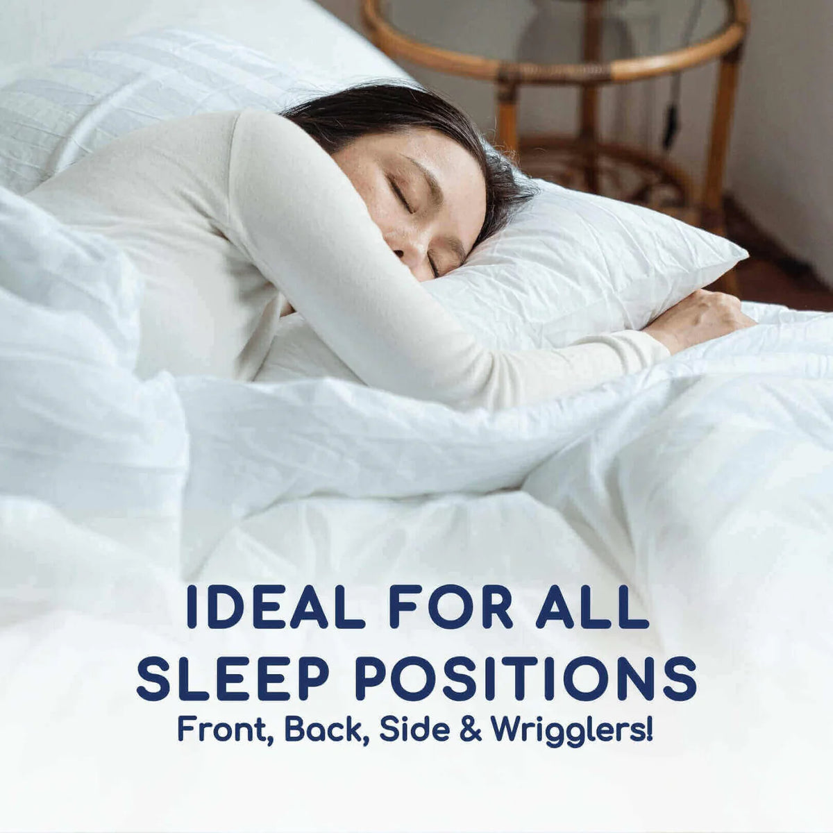 Person sleeping in bed with text 'Ideal for all sleep positions Front, Back, Side & Wrigglers!'